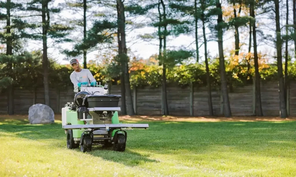 lawn squad article employee moving lawn